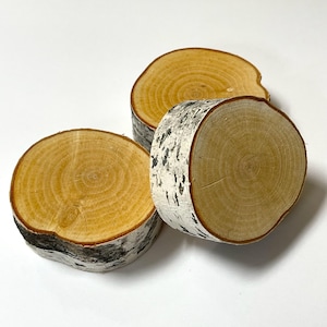 May include: A white ceramic mug with a black handle and the text "But First, Coffee" in a handwritten style. The mug is on a white surface. The mug is 4 inches tall.