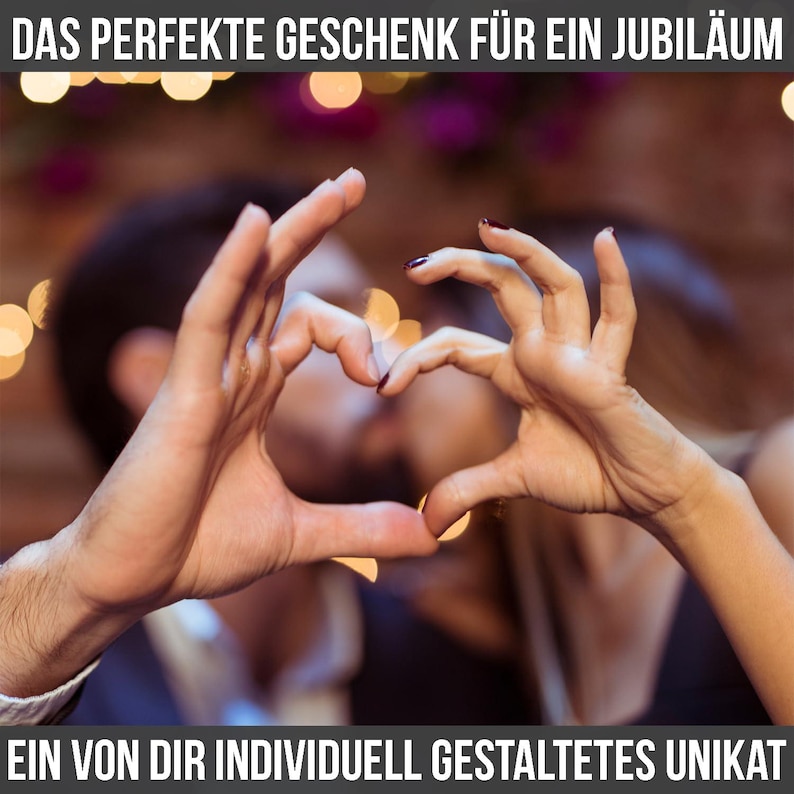 May include: Image of two hands forming a heart shape, with a blurred background of a couple kissing. The text at the top reads "THE PERFECT GIFT FOR AN ANNIVERSARY" and the text at the bottom reads "A UNIQUE ITEM INDIVIDUALLY DESIGNED BY YOU."
