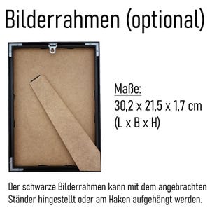 May include: A black picture frame with a cardboard backing and a wooden stand. The frame measures 11.9 x 8.5 x 0.7 inches. The text on the image says the frame can be displayed with the stand or hung.