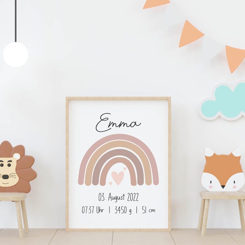 May include: A framed print featuring the name "Emma" in cursive above a pastel rainbow design. Below the rainbow are the date, time, weight (3450 grams), and height (51 cm) of a baby. The print is in a light wood frame.