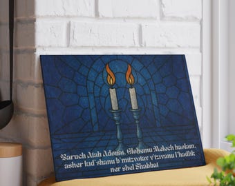 May include: A blue canvas print featuring a stained-glass design with two lit candles in ornate holders. The image includes text in a script font. The candles have orange and yellow flames. The background is a dark blue color.