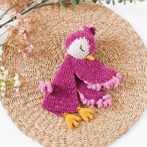 Soft bird-shaped snuggle blanket for babies, made from gentle fabric for comfort and relaxation, perfect for naps and bedtime.