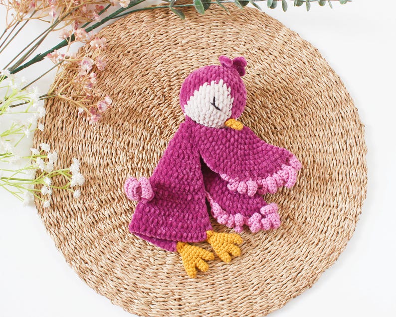 Soft bird-shaped snuggle blanket for babies, made from gentle fabric for comfort and relaxation, perfect for naps and bedtime.