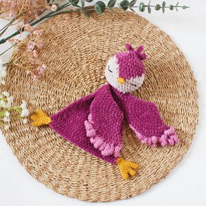 Soft bird-shaped snuggle blanket for babies, made from gentle fabric for comfort and relaxation, perfect for naps and bedtime.