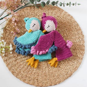 Soft bird-shaped snuggle blanket for babies, made from gentle fabric for comfort and relaxation, perfect for naps and bedtime.