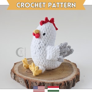 May include: A handmade crochet chicken in white, gray, red, and yellow, sitting on a wooden slice. The chicken has a red comb and wattle, gray wings, and yellow feet. The text "CROCHET PATTERN" is at the top.