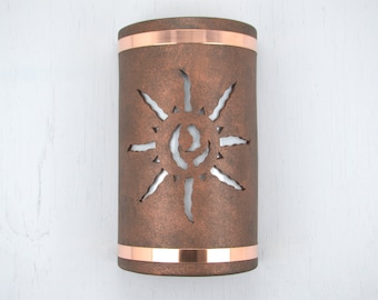 Southwestern light-Ancient Sun design cut-Open top wall sconce-Finished in Antique Copper color-Indoor/Outdoor