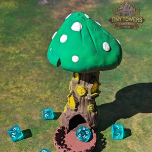 May include: A green and white mushroom-shaped tower with a brown base and a yellow interior.  The tower is surrounded by six blue dice with white numbers. The text "TINY TOWERS FATES END TT197" is visible in the upper right corner of the image.