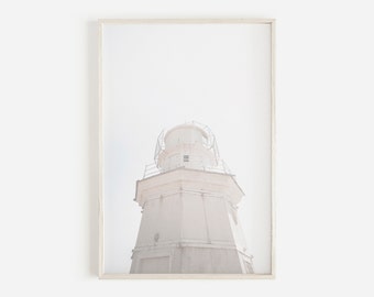 May include: A white lighthouse with a metal frame and a white background.