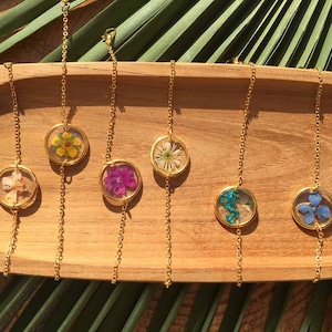 Golden bracelet of pressed flowers in resin