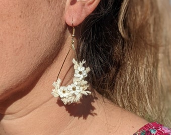 Hanging earrings in real flowers