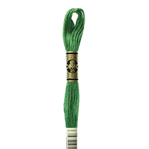 May include: A spool of DMC embroidery floss in color 700, a bright green. The label reads "DMC" with the number "25" and "8 m (8.7 yd)".