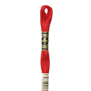 May include: A spool of red DMC embroidery floss with a label that reads "DMC Mouliné Special 25 8.7 yd 24180450 666"