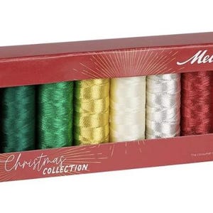 May include: A set of three ceramic mugs with a speckled, matte finish. The mugs are in shades of cream, light gray, and dark gray. Each mug has a simple, modern design and a rounded handle.