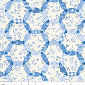 May include: A fabric pattern featuring overlapping blue oval shapes with various patterns, including floral, gingham, and striped designs. Delicate blue floral sprigs are scattered across a cream-colored background. The fabric is marked with inch measurements.