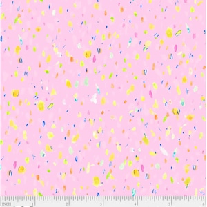 Puede incluir: Tela rosa con un patrón de confeti amarillo, azul, verde y naranja. La tela tiene un patrón repetitivo de pequeñas formas coloridas.