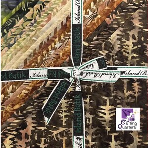 May include: A bundle of patterned fabric squares in shades of brown, green, and beige, secured with a ribbon printed with "Island Batik." The fabric designs include leaf and tree motifs. The Cutting Quarters logo is visible.
