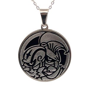 May include: A silver-colored pendant necklace featuring a circular pendant with a detailed, stylized design. The pendant has a dark, contrasting background that highlights the intricate artwork. The necklace chain is also silver.