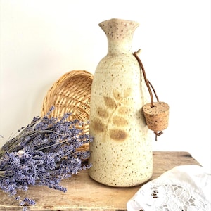 Very large stoneware jug with cork stopper