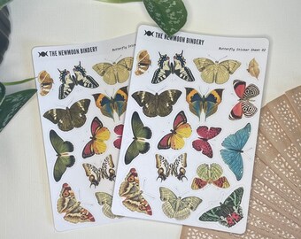 May include: Two sheets of butterfly stickers with a white background. The stickers feature colorful butterflies with intricate patterns and designs. The sheets are labeled "The Newmoon Bindery" and "Butterfly Sticker Sheet 02".