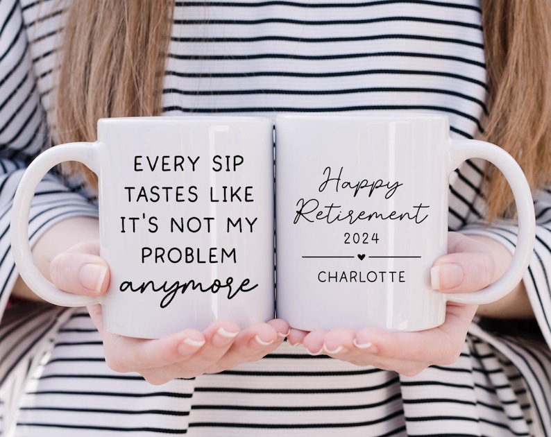 May include: Two white ceramic mugs with black text. One mug reads "EVERY SIP TASTES LIKE IT'S NOT MY PROBLEM anymore." The other mug says "Happy Retirement 2024" with a heart and the name "Charlotte".
