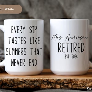 May include: Two white ceramic mugs. One mug has the text "EVERY SIP TASTES LIKE SUMMERS THAT NEVER END" in black. The other mug says "Mrs. Anderson RETIRED EST. 2026" in black.