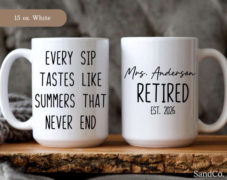 May include: Two white ceramic mugs. One mug has the text "EVERY SIP TASTES LIKE SUMMERS THAT NEVER END" in black. The other mug says "Mrs. Anderson RETIRED EST. 2026" in black.