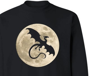 May include: Black sweatshirt with a silhouette of a dragon flying in front of a full moon.
