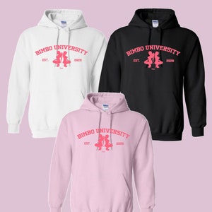 May include: Three hooded sweatshirts in white, black, and pink with the text "BIMBO UNIVERSITY EST. 2020" and a pink silhouette of two women in a squatting pose.