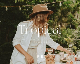 May include: A woman wearing a brown hat and white shirt stands in a garden setting. The text "Tropical" is displayed in white letters above the text "Mobile & Desktop Lightroom Presets 15 Presets".