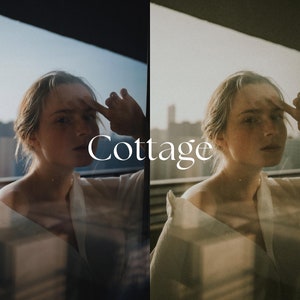 May include: A woman with blonde hair is standing in front of a window. She is wearing a white shirt and has her hand on her forehead. The word "Cottage" is written in white text on the window.