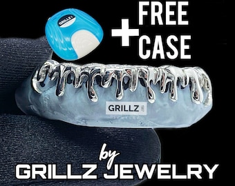 May include: Silver grillz with a dripping design. The grillz are displayed in a hand. The image includes the text "GRILLZ 1987" and "FREE + CASE".
