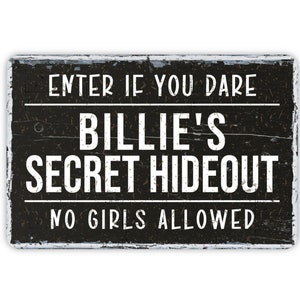 May include: Black and white sign with distressed wood texture. The sign reads "Enter if you dare Billie's Secret Hideout No Girls Allowed".
