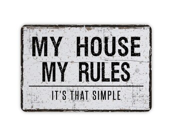 May include: White wooden sign with black text that reads "My House My Rules It's That Simple".