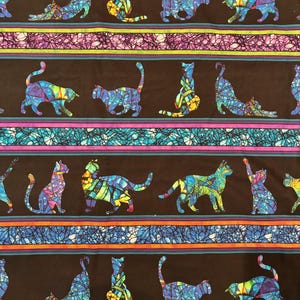 May include: Fabric with a repeating pattern of colorful cat silhouettes in various poses. The cats are filled with stained glass-like designs in shades of blue, green, yellow, and purple, set against a black background with striped borders.