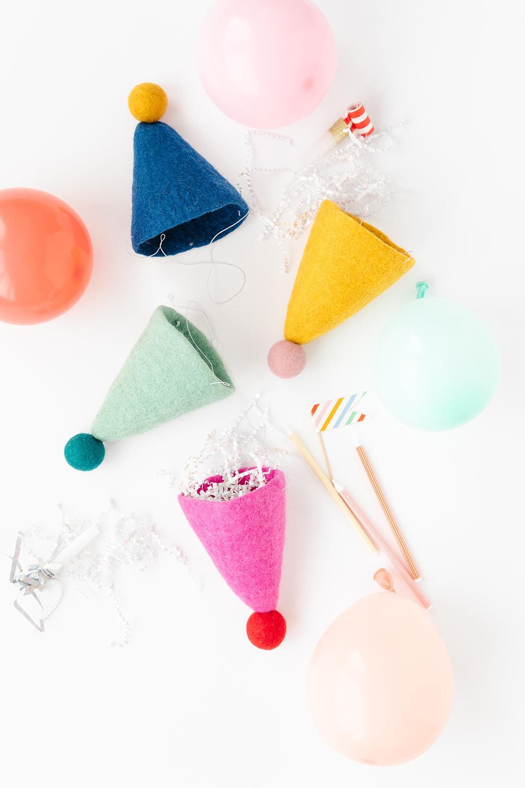 Vilten feestmuts | Herbruikbaar en milieuvriendelijk feestdecor | Vilten hoed met pompons
