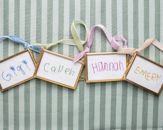 Handwritten Embroidered Ornaments in Gold Glass Case