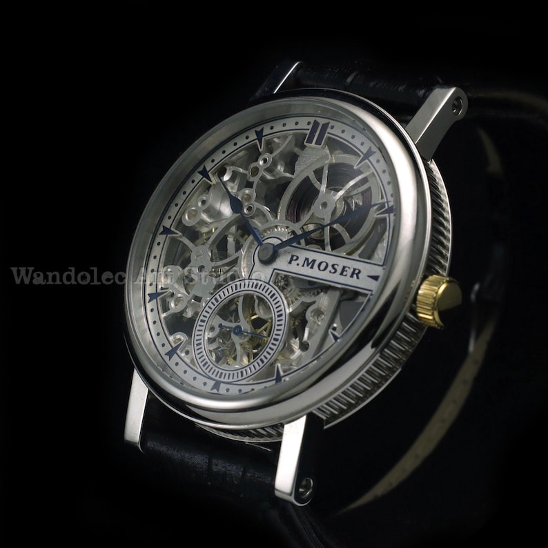May include: A silver skeleton watch with a black leather band. The watch face features intricate gears and the text "P.MOSER". The watch has a gold-colored crown and a round face.