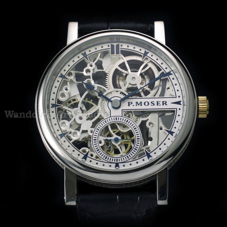 May include: A silver-toned skeleton watch with a black leather band. The watch face reveals intricate internal mechanisms, with blue hands and accents. The watch has a gold-colored crown and the brand name "P. MOSER" is visible.