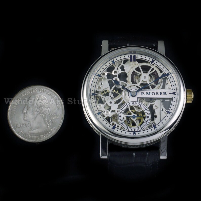 May include: A silver-toned skeleton watch with a black leather band. The watch face reveals intricate internal mechanisms and the brand name "P. MOSER". A U.S. quarter is next to the watch for size comparison. The watch has a gold-colored crown.
