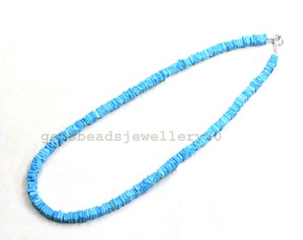 May include: A light blue turquoise necklace made of square-shaped beads. The necklace is strung on a silver chain and has a silver clasp.