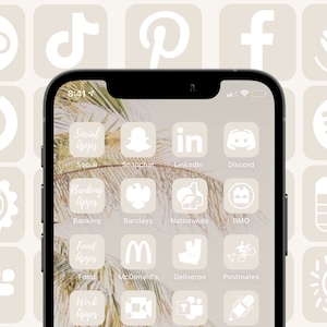 Könnte beinhalten: Ein Screenshot eines iPhones, auf dem verschiedene App-Symbole auf einem beigefarbenen Hintergrund angezeigt werden. Die Symbole sind weiß und umfassen Social-Media-, Banking-, Lebensmittelliefer- und Arbeits-Apps. Die Symbole sind in einem Raster angeordnet und mit dem App-Namen beschriftet.