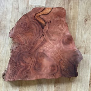 Redwood Burl slab/some live edge 14”x12”x1.25” Dampened to show finish look. I also have a duplicate of this.  Ethically reclaimed in Nor CA