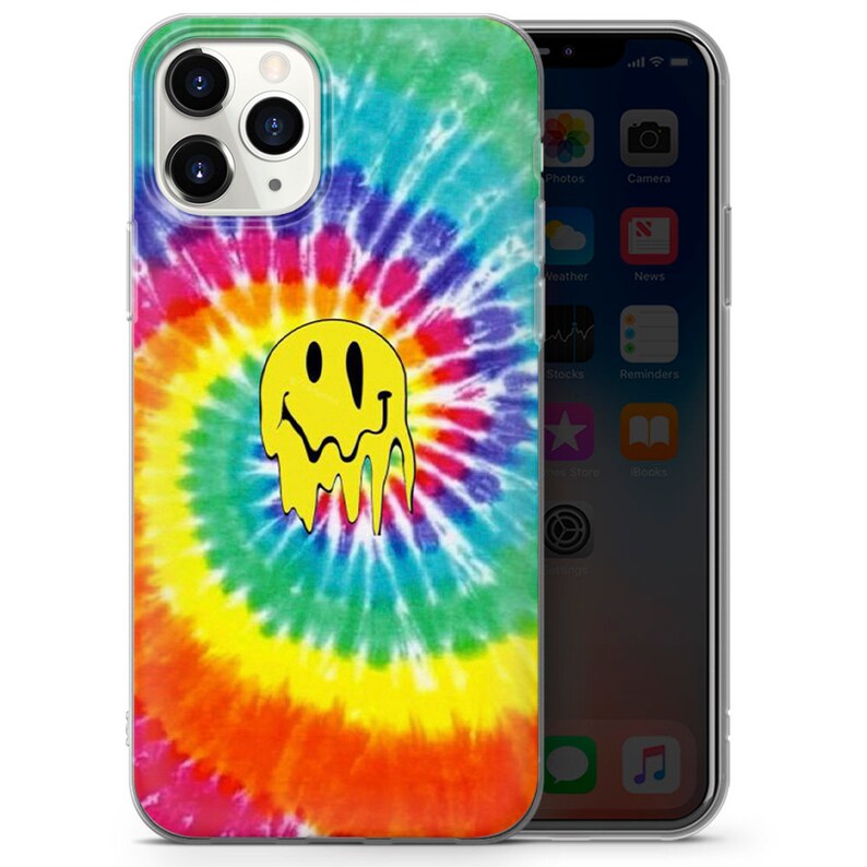 May include: A clear phone case with a tie-dye pattern in shades of blue, green, yellow, orange, and red. A yellow smiley face with dripping black lines is centered on the case.
