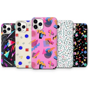 May include: Five phone cases featuring bold, geometric designs. Patterns include black with neon accents, cream with blue circles and red squares, pink with abstract shapes, white with teal and black lines, and black with colourful dots.