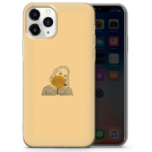 May include: A yellow phone case with a line drawing of a person holding a sunflower in front of their face.