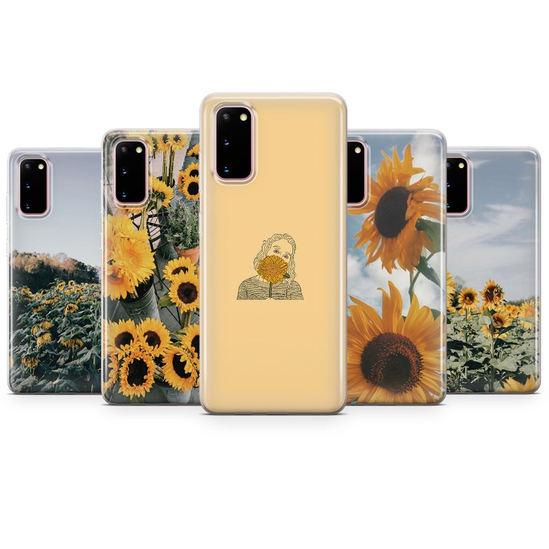 May include: Set of five phone cases featuring different sunflower designs. One case has a line drawing of a person holding a sunflower in front of their face. Another case has a field of sunflowers with a blue sky in the background. Another case has a close-up of a sunflower with a blue sky in the background. Another case has a close-up of a sunflower with a green background. Another case has a close-up of a sunflower with a green background.