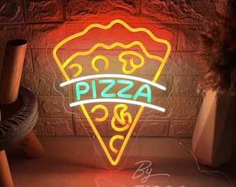 May include: Neon pizza slice sign with the word "PIZZA" in green and white. The sign is outlined in yellow and orange, with a clear backing. The sign also includes the text "By ZP ZL Neon Custom".