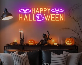May include: A neon sign with the words "HAPPY HALLOWEEN" in orange and purple. The sign features bat and witch hat designs. The sign is mounted on a wall above a black couch with decorative pillows and lit candles, creating a festive Halloween atmosphere.