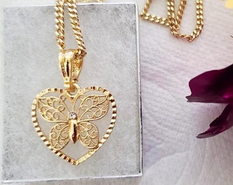 Collana con pendente a forma di luna e farfalla in oro 18 carati